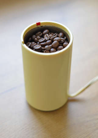 A blade or propeller coffee grinder on the table top.の写真素材