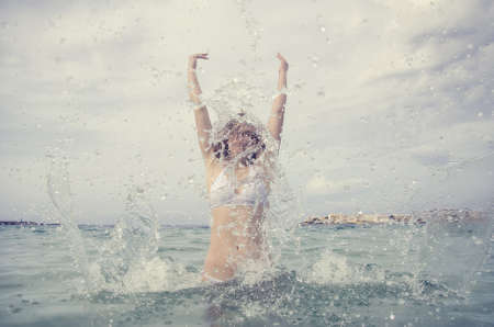 Woman enjoying her vacation in the sea.の写真素材