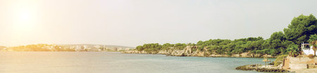 Sunny panoramic view of the beach and the city.