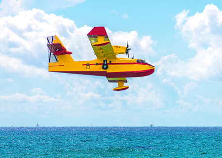 Aerial firefighting.  Aircraft preparing to collect sea water.の写真素材