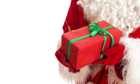 Santa is holding gift. Isolated on white. Place for your text.