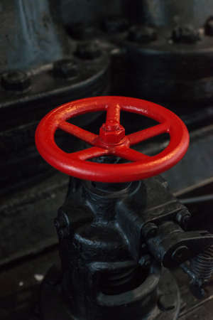 Red valve. Part of old power plant.の写真素材