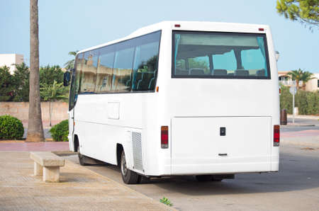 Bus waiting for passengers at bus stop.の写真素材