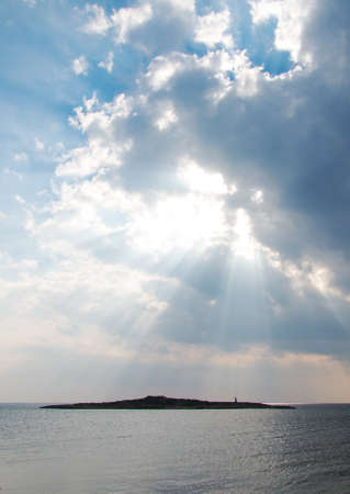 Rays of light. Sunset over the sea.の写真素材