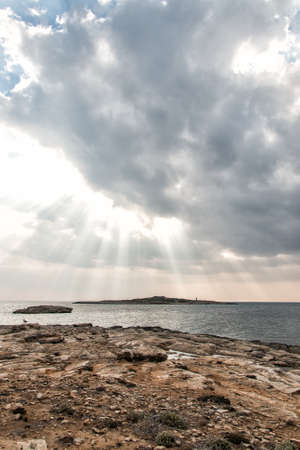 Rays of light. Sunset over the sea.の写真素材