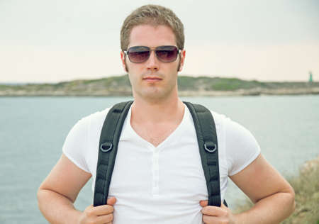Portrait of male tourist with backpack.の写真素材