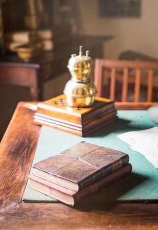 Old books lying on the dusty table.の写真素材