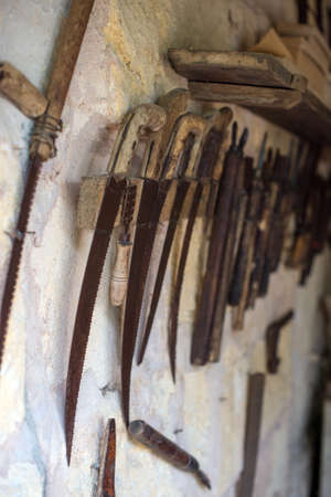 Wall with pile of vintage hand tools.の写真素材