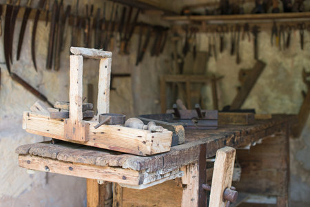 Room with pile of vintage hand tools.