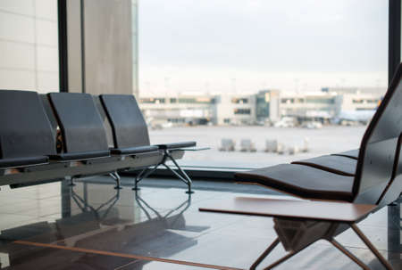 Empty seats in terminal waiting room in airport.の写真素材