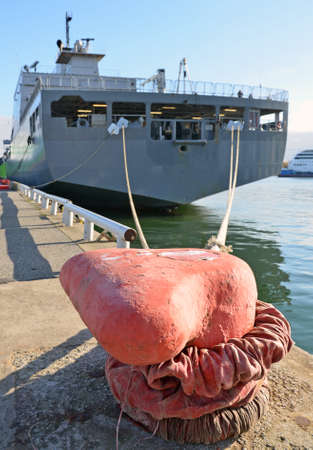 Naval auxiliary ship docked at the harbor.の写真素材