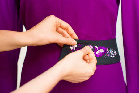 Female fashion designer working on mannequin.の写真素材