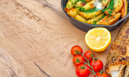 Fried fish and potatoes. Place for your text.の写真素材