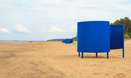 Blue beach huts on the empty beach.の写真素材