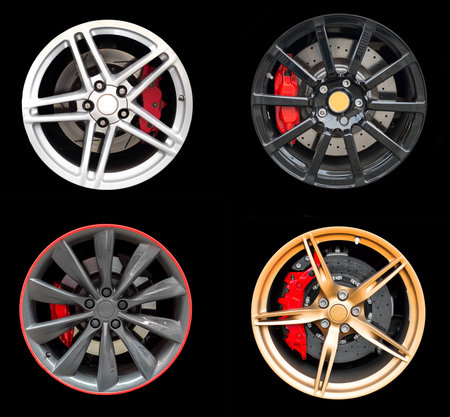Collage of Four car rims isolated on black background.の写真素材