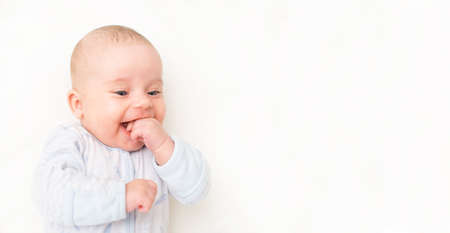 Smiling cute little baby. Place for your text.の写真素材