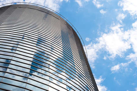 Modern round glass building in the city.の写真素材