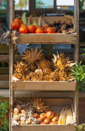 Stand with rotten vegetables and fruits on the street.の写真素材