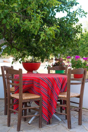 Mediterranean cafe terrace exterior with chairs.の写真素材