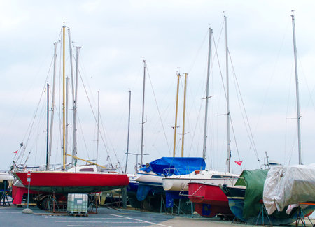 Yachts parked on the beach in the off-season.