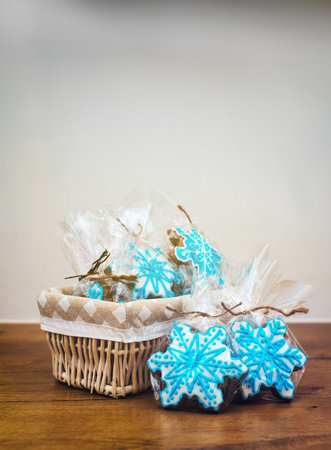Packed box of cookies on the wooden table. Place for text.