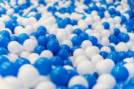 A lot of blue and white plastic balls in playroom.の写真素材