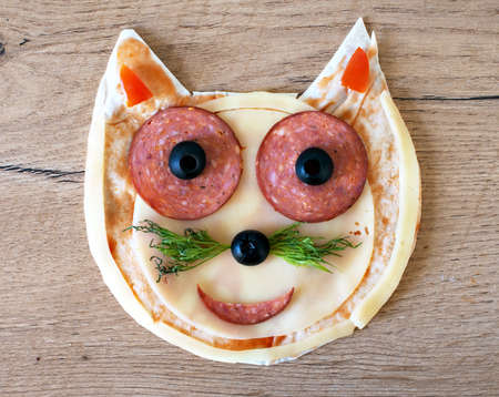 Handmade pizza in the form of cat.の写真素材