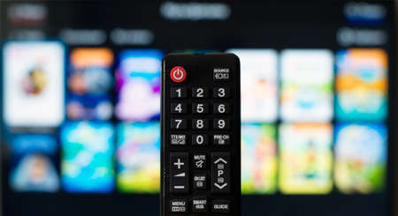 TV remote control against SmartTV operating system.の写真素材