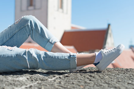 Woman relaxing in the old town.の写真素材