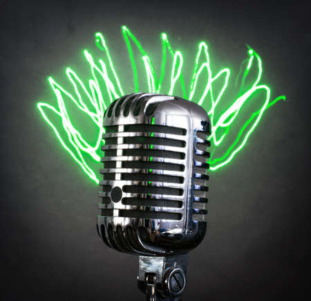 Retro microphone with green laser rays.の写真素材
