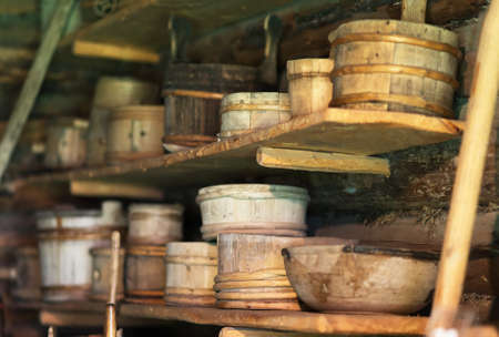 Storage racks with old wooden bowls.の写真素材