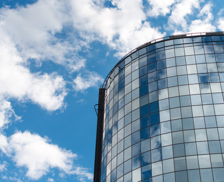 Modern round glass building in the city.