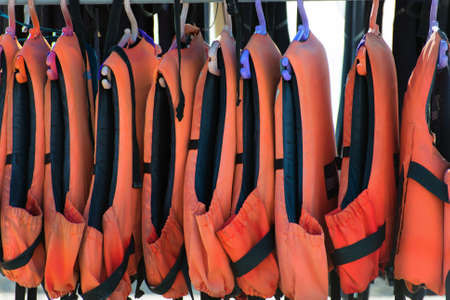 Many life jackets on the beach.の写真素材