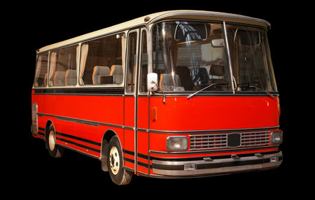 Old retro red bus. Isolated on black background.