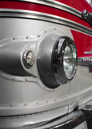 Close-up view of retro bus headlight.
