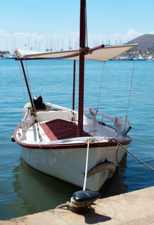 Wooden boat moored at the dock.