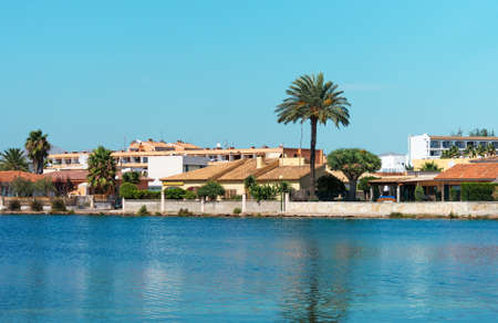 Several houses near pond. Alcudia, Mallorca.の写真素材