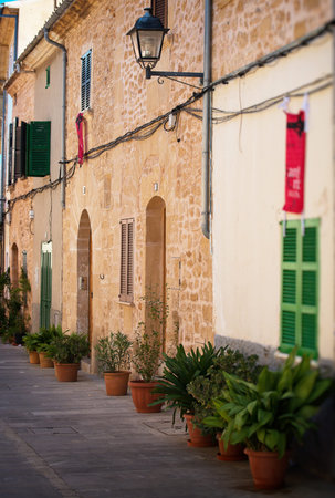 Beautiful narrow old street in mediterranean city.の写真素材