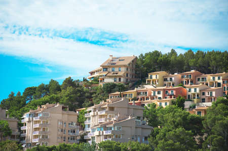 Houses in the green mountain hills.の写真素材