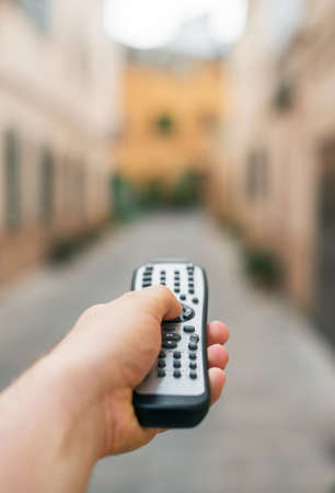 Summer vacation concept. Man holding remote control.の写真素材