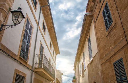 Beautiful narrow old street in mediterranean city.の写真素材