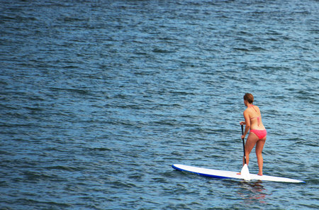 Stand up paddle surfing. Place for text.