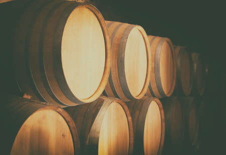 Wine barrels stacked in the cellar.の写真素材