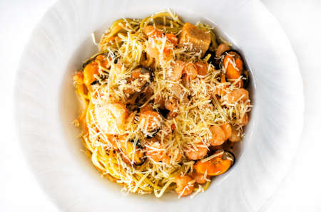 Spaghetti with seafood and grated cheeseの写真素材