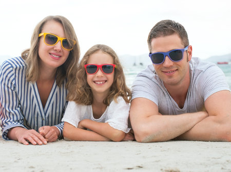 Happy family on the beach vacation.