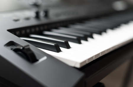 Professional midi keyboard synthesizer with knobs and controllers.の写真素材