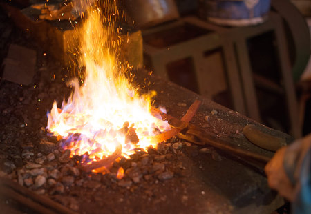 Making of horseshoe. Hot horseshoe in forge.