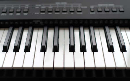 Professional midi keyboard synthesizer with knobs and controllers.の写真素材