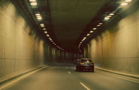 Cars driving through the tunnel.の写真素材