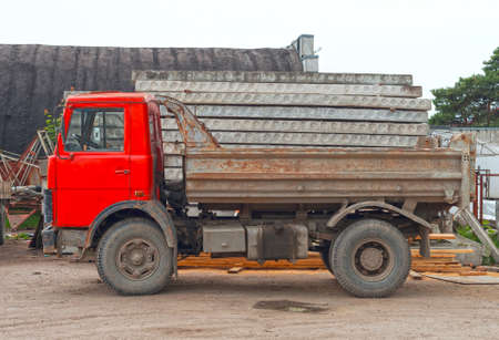Empty old soviet tipper truck on construction site.の写真素材